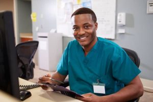Male nurse at the table
