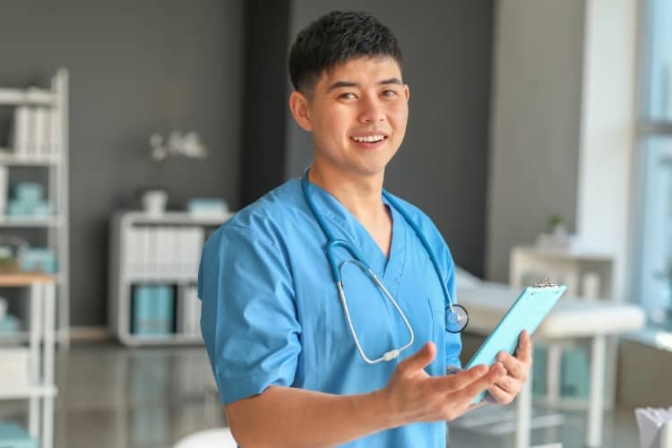 Male nurse is smiling