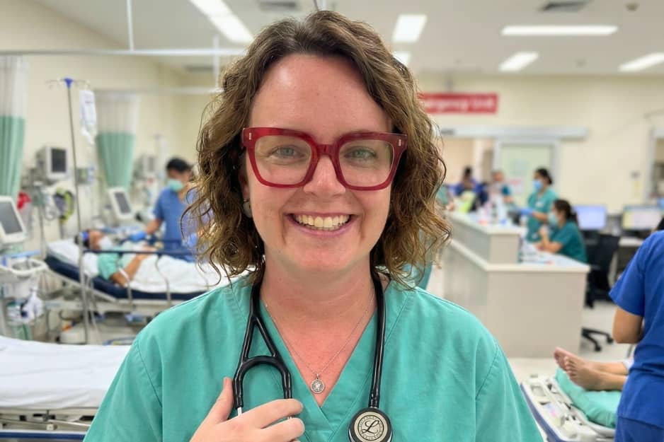 An ER nurse, happy and smiling